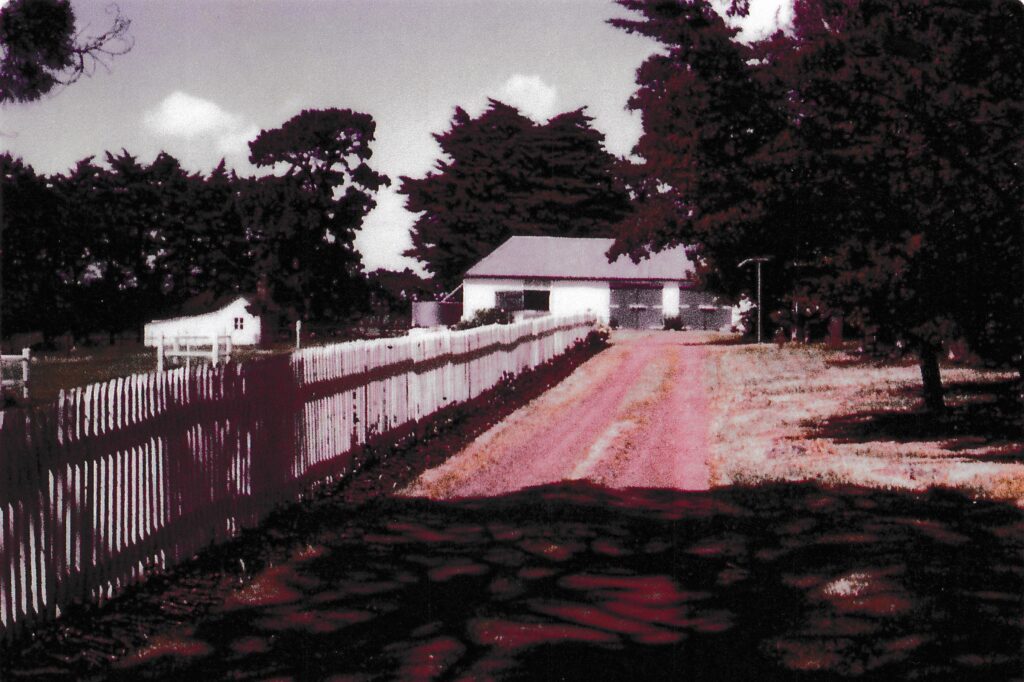 White picket fence leading to the house at Mac'sfield
